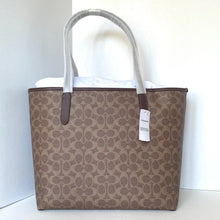 Load image into Gallery viewer, Brown patterned tote bag with white handle on a white background