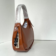Load image into Gallery viewer, Brown handbag with a visible brand tag on a white background