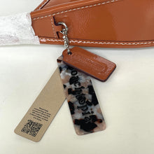 Load image into Gallery viewer, Acrylic keychain with 'Ochiltrea' branding and QR code on a white background