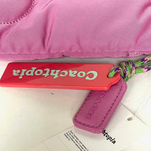 Load image into Gallery viewer, Pink Coach bag with a red tag on a white surface