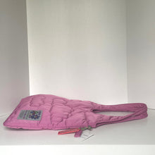 Load image into Gallery viewer, Pink quilted bag with a visible brand label on a white background