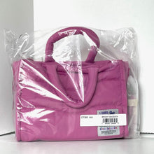 Load image into Gallery viewer, Pink handbag in clear plastic packaging on a white background