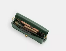 Load image into Gallery viewer, Green handbag with gold accents on a white background