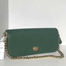 Load image into Gallery viewer, Green handbag with gold chain on a white background