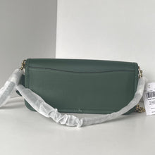Load image into Gallery viewer, Green handbag with a gray strap on a white background