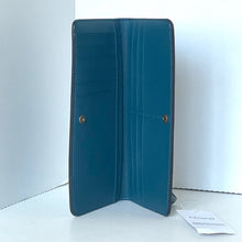Load image into Gallery viewer, Blue wallet on a white surface with a white background
