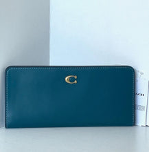 Load image into Gallery viewer, Teal wallet with gold logo on a white surface