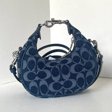 Load image into Gallery viewer, Blue handbag with a pattern on a white background