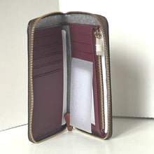 Load image into Gallery viewer, Open maroon wallet with gold zipper on a white background