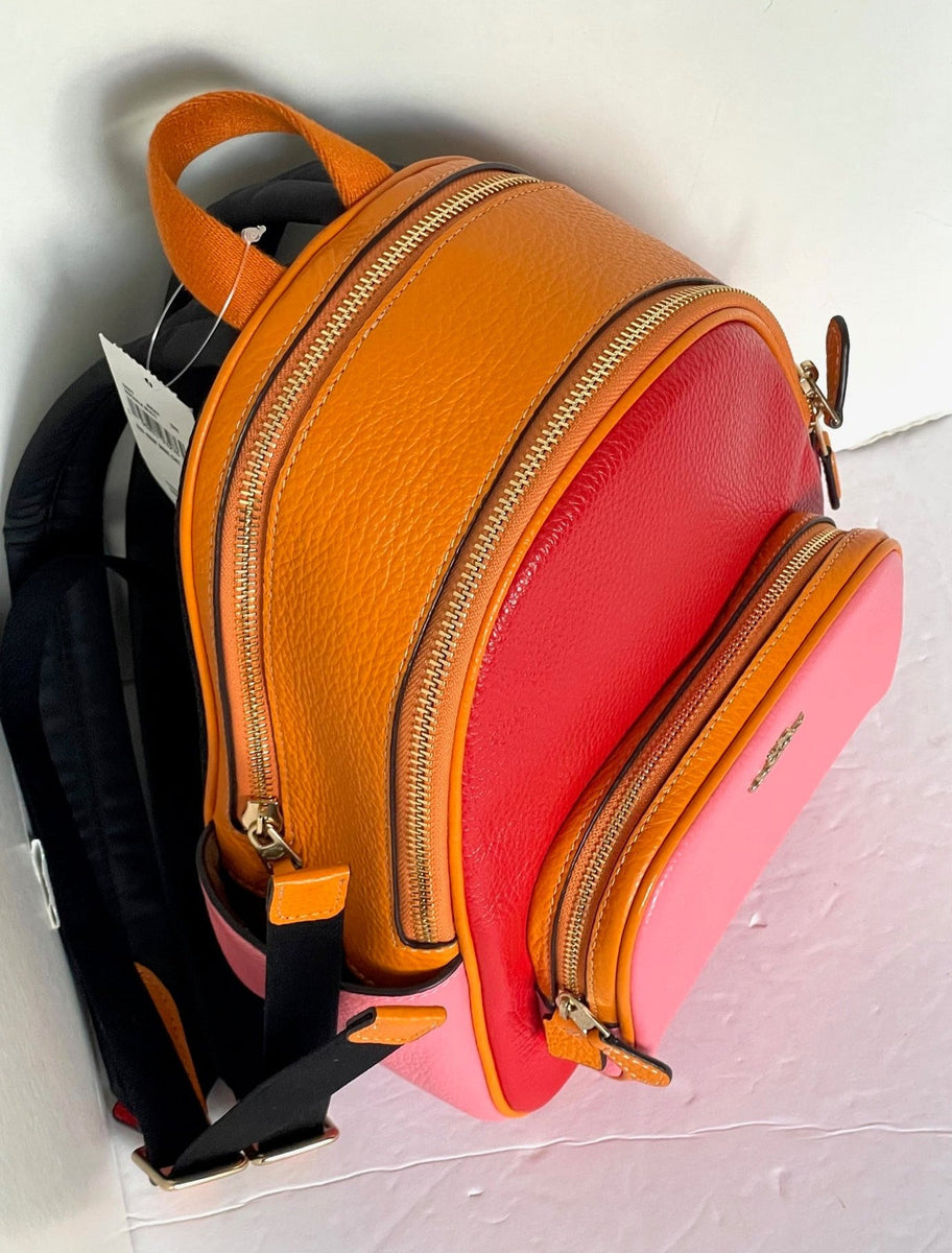 coach backpack orange Signature coated canvas and refined pebble leather Inside zip and multifunction pockets Double zip closure fabric lining Handle with 1 1/2 drop Outside zip and open pockets Adjustable shoulder straps 8 (L) x 9 (H) x 3 1/2 (W) Style No. Coach Terrain Coach Orange Backpack