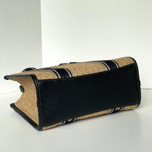 Load image into Gallery viewer, Black and beige handbag on a white background