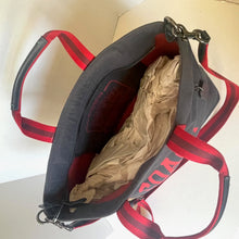 Load image into Gallery viewer, Black and red bag with a beige interior on a light background