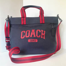 Load image into Gallery viewer, Black and red Coach bag with visible branding on a white background