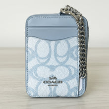 Load image into Gallery viewer, Light blue Coach wallet with chain detail on a white background