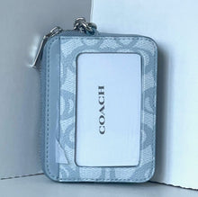 Load image into Gallery viewer, Coach wallet with floral pattern on a white background