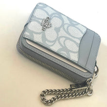 Load image into Gallery viewer, Gray wallet with chain strap on a beige background