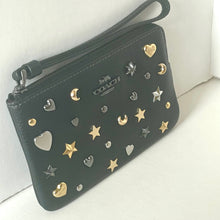 Load image into Gallery viewer, Coach wallet with star and heart embellishments on a white background
