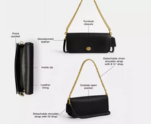 Load image into Gallery viewer, Black handbag with gold chain strap, featuring various design elements and features on a white background.
