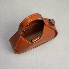 Load image into Gallery viewer, Brown leather bag on a light gray background