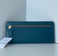 Load image into Gallery viewer, Teal wallet with gold zipper on a light gray background