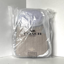 Load image into Gallery viewer, Coach backpack in clear plastic packaging on a white background