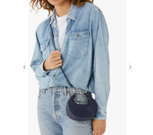 Load image into Gallery viewer, Person wearing a light blue denim jacket and jeans, holding a navy blue coach beaded crystal handbag.