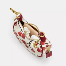 Load image into Gallery viewer, Small pouch with red heart pattern and gold zipper on a white background