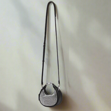 Load image into Gallery viewer, Black crystal beaded leather handbag with a strap on a light gray background