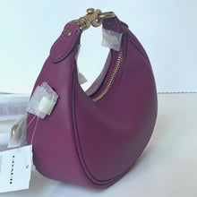 Load image into Gallery viewer, Purple handbag with gold zipper and tag on a white background