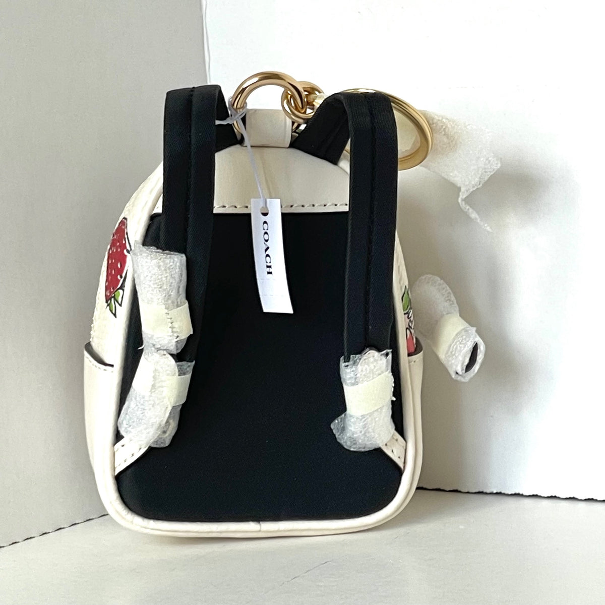 court mini backpack Coach Refined pebble leather Inside zip and multifunction pockets Double zip closure fabric lining Handle with 1 1/2 drop Outside zip and open pockets Adjustable shoulder straps 8 (L) x 9 (H) x 3 1/2 (W) The Coach Foundation continues to partner with the Hetrick Coach Mini Court Strawberry Backpack