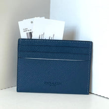 Load image into Gallery viewer, Blue Coach wallet with cards on a white background