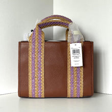 Load image into Gallery viewer, Brown leather handbag with purple and gold striped handle on a white background