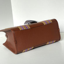 Load image into Gallery viewer, Brown leather clutch with patterned flap on a white background