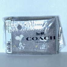 Load image into Gallery viewer, Coach wallet with Snoopy design in packaging on a light blue background