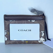 Load image into Gallery viewer, Coach wallet with brand logo on a light blue background