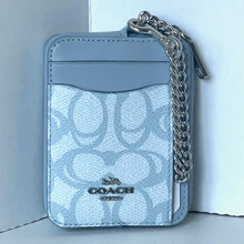 Load image into Gallery viewer, Light blue Coach wallet with chain detail on a white background