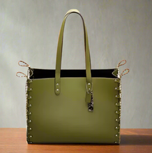 Load image into Gallery viewer, Green handbag with studded details on a white background