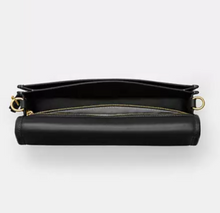Load image into Gallery viewer, Black leather clutch bag with gold accents on a white background