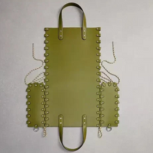 Load image into Gallery viewer, Green leather bag with studs and chains on a gray background