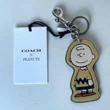 Load image into Gallery viewer, CoachxPeanuts2025CharlieBrownLeatherBagCharmKeychainCBG59Anniversary_2