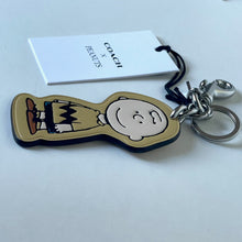 Load image into Gallery viewer, CoachxPeanuts2025CharlieBrownLeatherBagCharmKeychainCBG59Anniversary_2
