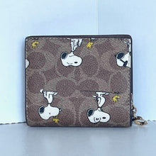 Load image into Gallery viewer, Coach x Peanuts 2025 Snap Wallet CBN89 Snoopy 75th Anniversary Woodstock Brown