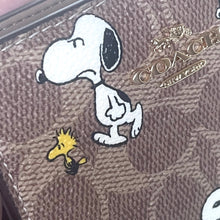 Load image into Gallery viewer, Coach x Peanuts 2025 Snap Wallet CBN89 Snoopy 75th Anniversary Woodstock Brown