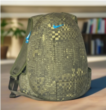 Load image into Gallery viewer, Green patterned backpack on a wooden floor with a blurred background