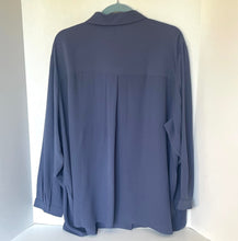 Load image into Gallery viewer, Blue shirt on a hanger against a white background