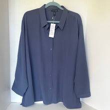 Load image into Gallery viewer, Blue shirt on a hanger against a white background