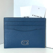 Load image into Gallery viewer, Blue cardholder with Coach logo on a white background
