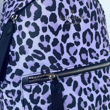 Load image into Gallery viewer, Purple backpack with black leopard print pattern and 'kate spade new york' logo.