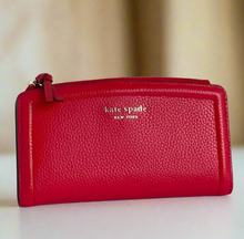 Load image into Gallery viewer, Red wallet with 'kate spade New York' logo on a white background