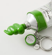Load image into Gallery viewer, Kate Spade Squeeze Paint Tube Bag Charm Key Fob Key Chain Artist Green Silver